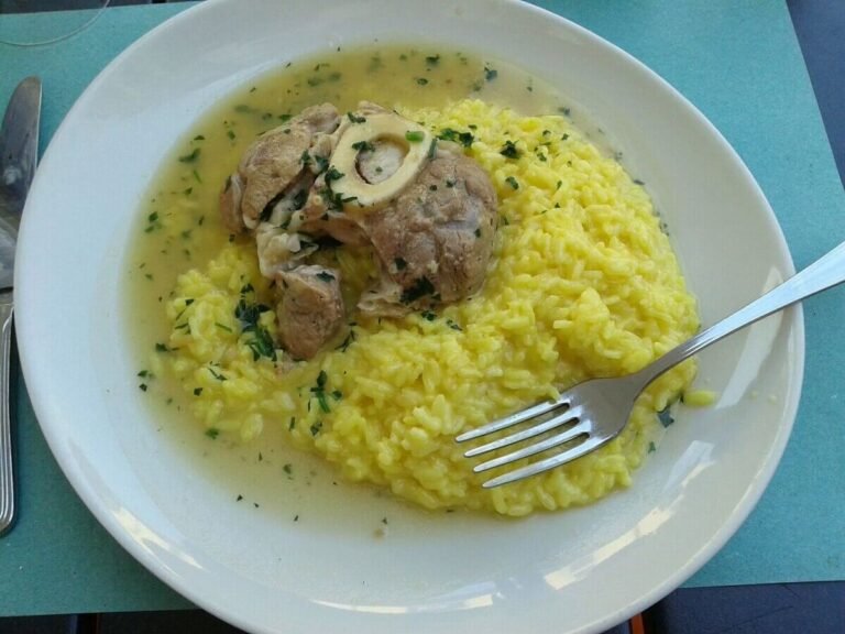 Traditional Ossobuco alla Milanese with saffron risotto and gremolata