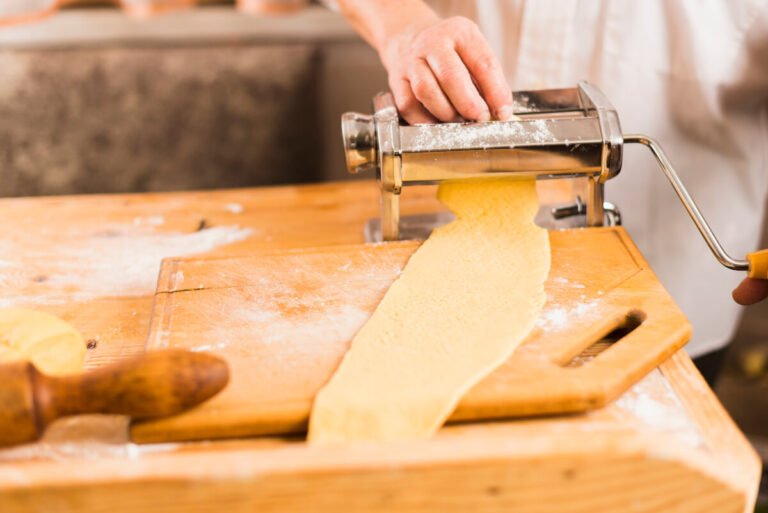 Fresh lasagna dough resting on a wooden board – authentic Italian pasta recipe