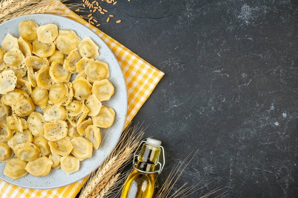 Homemade Italian tortellini – traditional fresh pasta filled with pork, prosciutto, mortadella and Parmigiano Reggiano